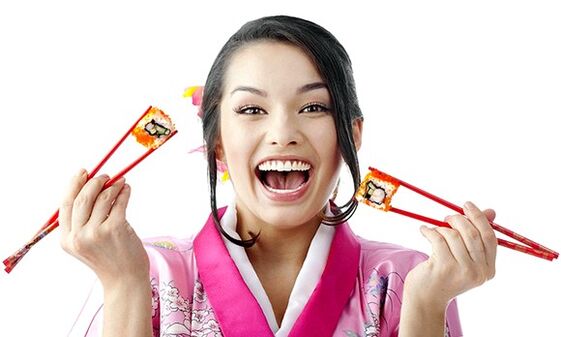 girl holding sushi for japanese diet